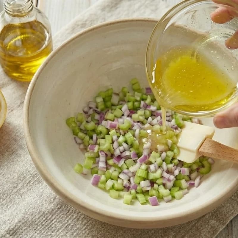 Step 3: Add half the dressing to the tuna mixture and gently fold to