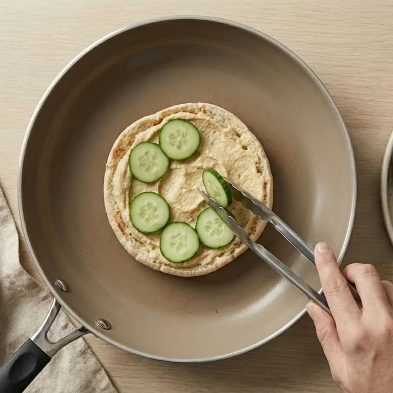Step 3: Layer shredded lettuce, cucumber slices, and tomato slices i