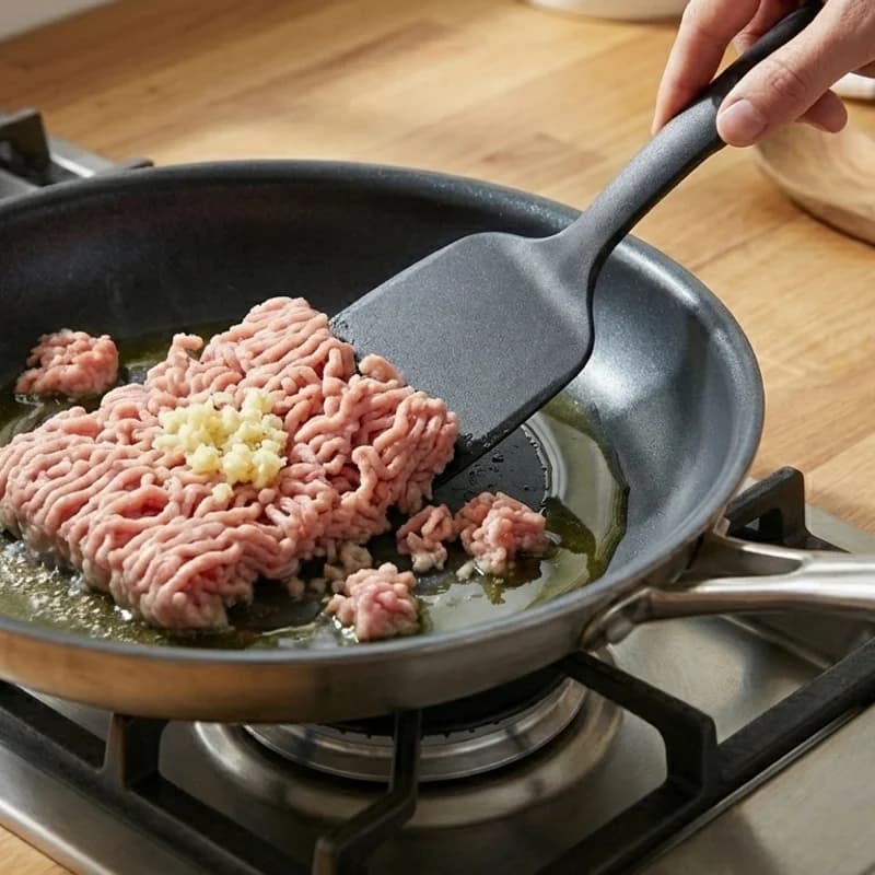 Step 2: Add ground turkey and minced garlic. Cook until turkey is br